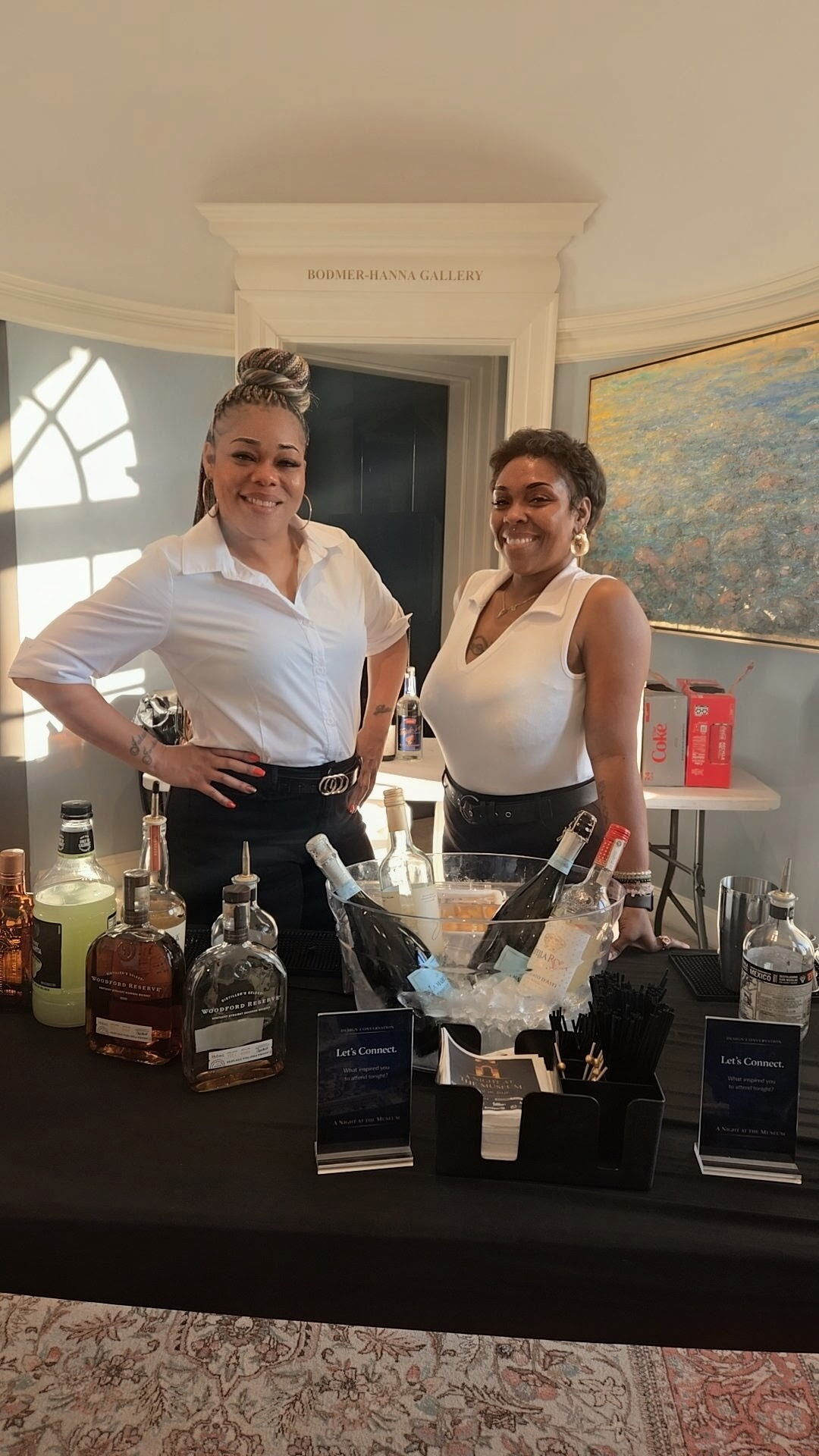 Bartending team preparing bottles and tools for an event